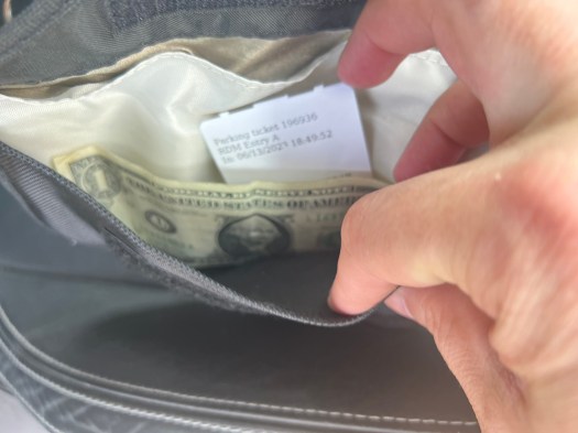 Front pocket will hold the airport parking ticket & cash.